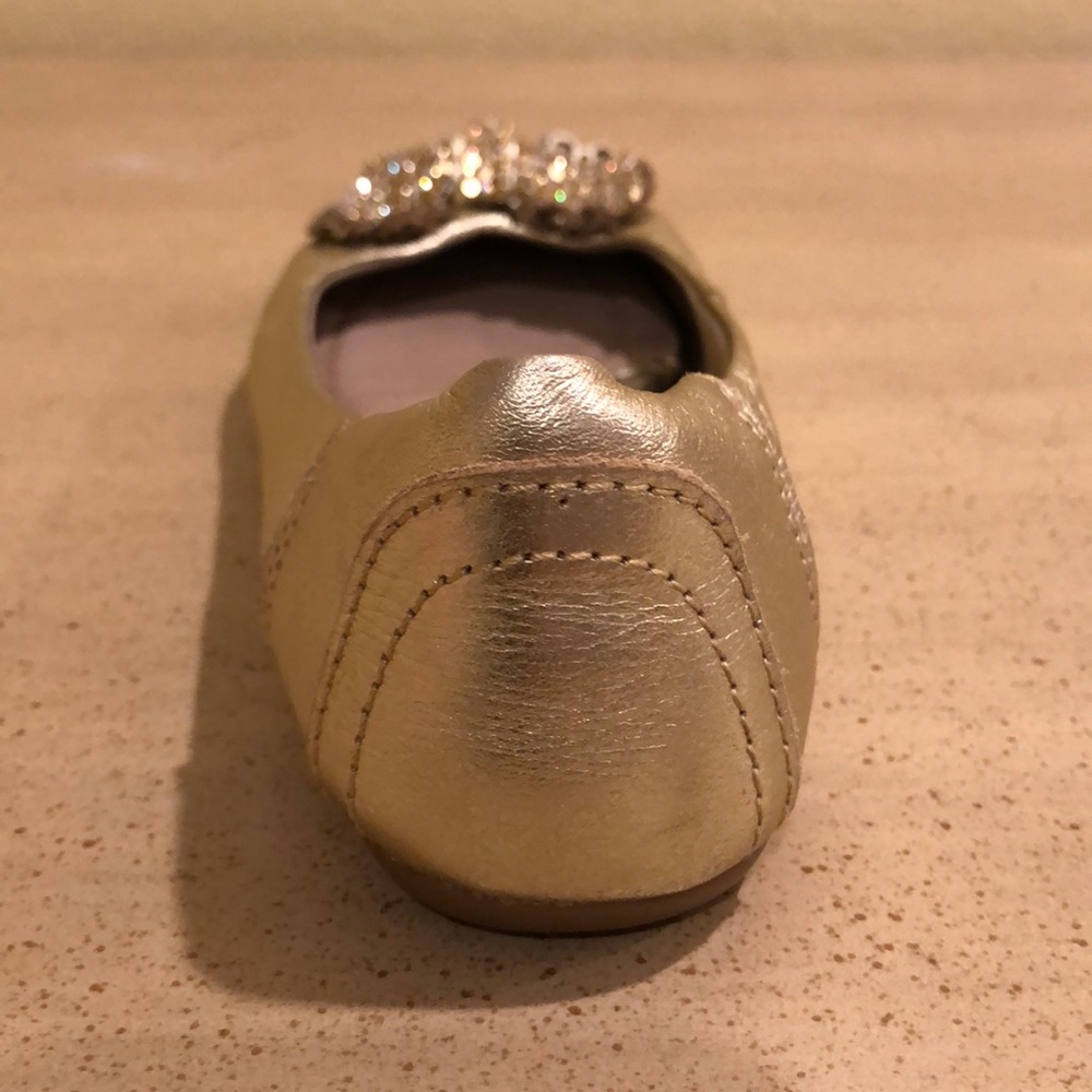 Gold flats with sparkly bow